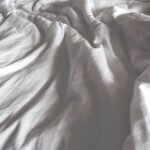 Inside Your Bed’s “Dirty Hidden Biome” And How To Keep Things Clean